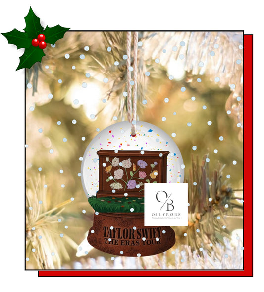An Eras Tour acoustic piano snow globe flat ornament